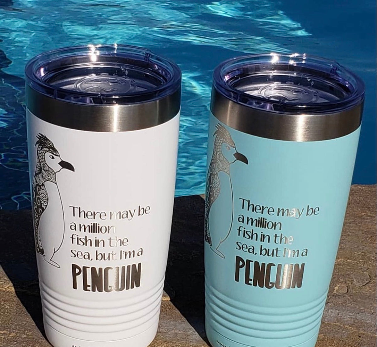 White and blue tumblers with penguin saying engraved