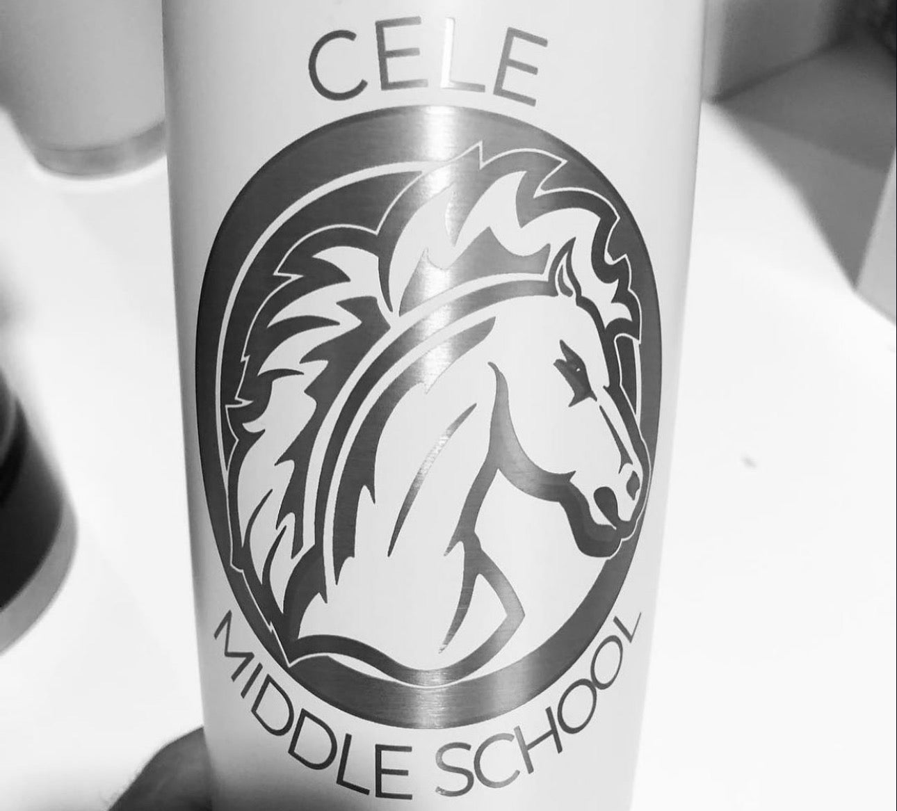CELE middle school and a horse engraved on white drinkware