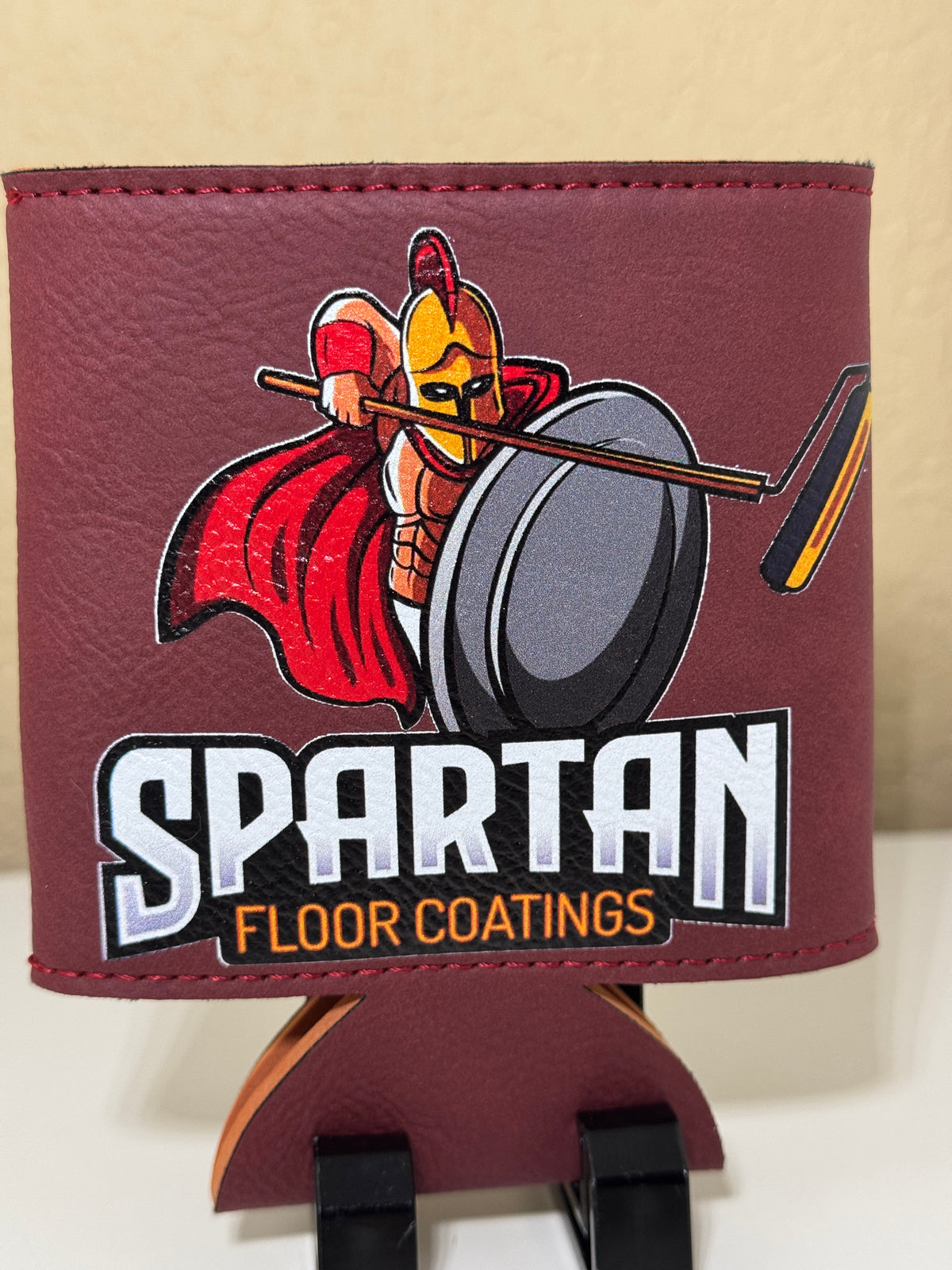 Maroon can cooler with Spartan Floor Coatings logo