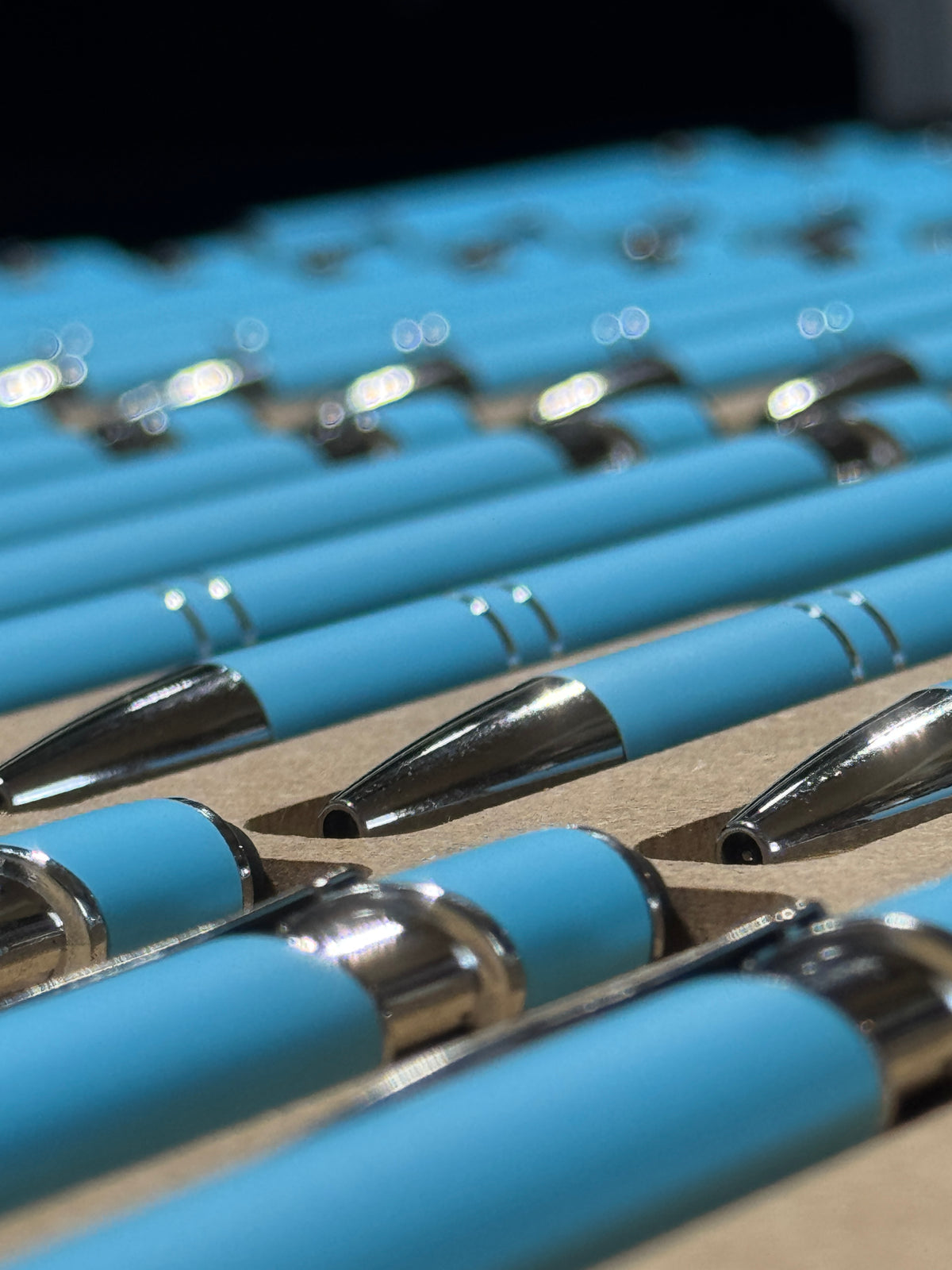 Close up shot of light blue pens
