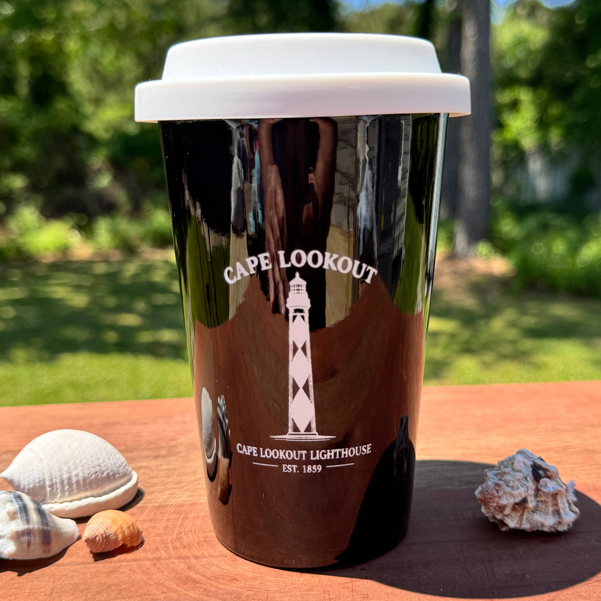 Black travel mug with Cape Lookout lighthouse